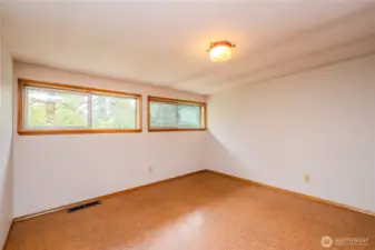 This space could also be used as a craft room, yoga or art studio or kids playroom!