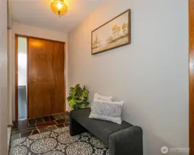 Step through the front door and you'll notice pretty slate floors, sizeble Living, Dining & Family Rooms.