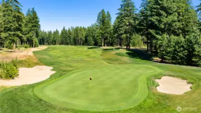 Lush green view of hole #4 on award winning golf course Rope Rider from your back patio.