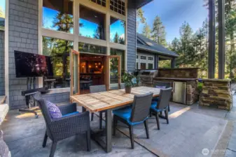 Spacious covered patio can host table that seats 12-14, an entertainer's dream coupled with the ability to do year round soirees.
