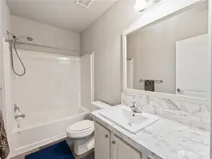 Guest bathroom and its on opposite end of home away from primary bedroom suite