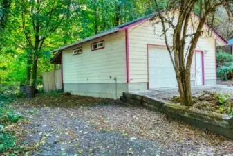 RV parking with power & water beside shop.