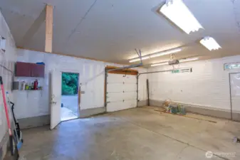 Shop also features three 220 outlets, each with its own circuit -walls are insulated and covered with tyvek wrap - ready for sheetrock if you choose.