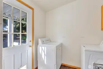 Laundry off kitchen with mud room access to backyard!