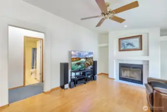 Family room with wood burning fireplace and new windows!