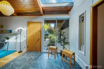 Slate flooring in the entrance, large windows and skylight.