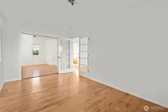 Bedroom 3 with closet organizer and mirrored bifold doors