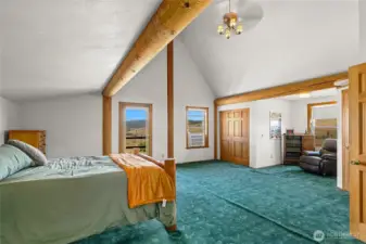 Oversized upstairs primary bedroom, has it's own balcony.