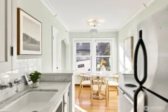 Charming features; marble counters, original hardwood floors, cool cabinetry.