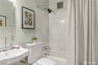 Adorably cute bathroom with nice finishes.