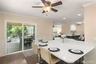 Gather your loved ones at this Custom Quartz table surrounded by windows overlooking the expansive deck and Greenbelt!