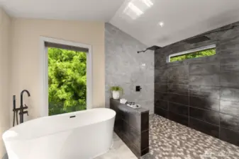 It doesn't get more luxurious than this freestanding tub and huge shower with floor to ceiling custom tile in the Primary Bath!