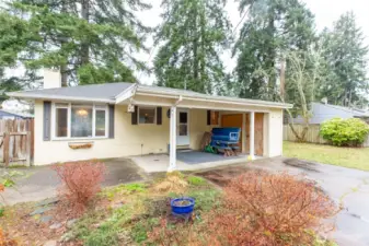 Back covered patio. Fenced gate on left goes to driveway