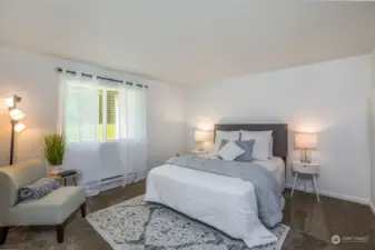 Primary Bedroom overlooking patio & grass area