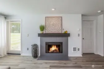 Wood burning fireplace & door to Patio