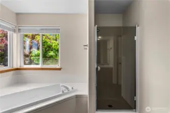 Primary Bedroom with soaking tub and walk in closet.