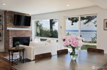 Your entire south side of your home has large windows and glass doors. A lovely wood fireplace to cozy up to on those chilly island evenings.