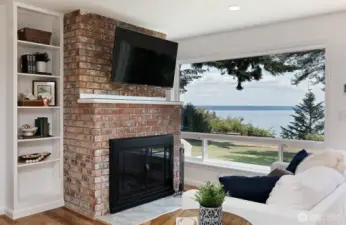 Built in shelving on both sides of the fireplace. The hallway to the three bedrooms is to the left of the bookshelf.