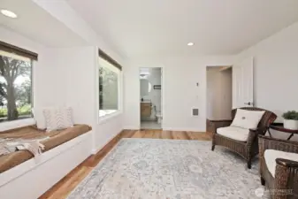 Looking back at the entrance to the Primary Suite and to the Primary full bath.