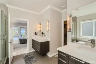 Double vanity en-suite bathroom with large built-in closet.