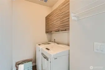 Utility room with storage cabinets