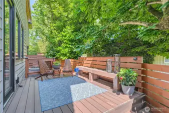 Deck with built-in bench and exterior lighting