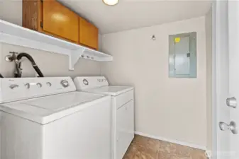 Laundry room and exterior entrance just off the kitchen.  Perfect for bringing groceries in!