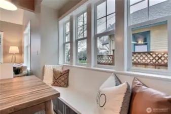 Custom-designed seating bench with storage shelves underneath.