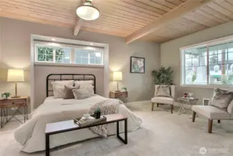 Luxurious primary bedroom with relaxing sitting area.