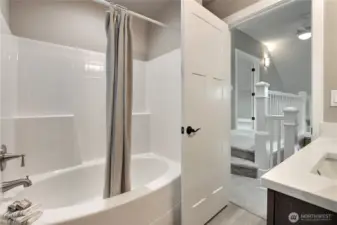 Oversized deep soaking tub for ultimate relaxation.