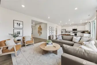 Great room open to kitchen. Perfect for hosting and staying connected to the ones you love.   Pictures are for representational purposes only, colors and features may vary.