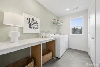 Desirable counterspace in the laundry room. Window to really open up the space as well.   Pictures are for representational purposes only, colors and features may vary.