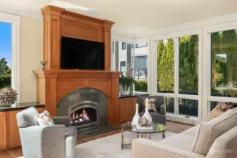 The family room is spacious and light-filled. The gas fireplace is the focal point of this room as well.