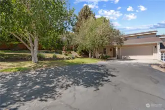 Front view of your next home on large 10,000sf lot with large driveway big enough for RV trailers and extra parking.  See beautiful private front yard with lots of shade and rockeries