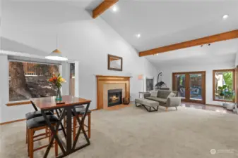 Wow check out this large great room with 25ft ceiling with exposed wood beams recessed lighting and lots of windows to bring even light and sunshine inside