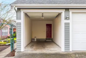 Sidewalk leads from the house to garage