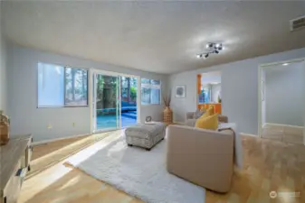 This family room is a cozy space with durable laminate flooring - perfect as a playroom or media room.