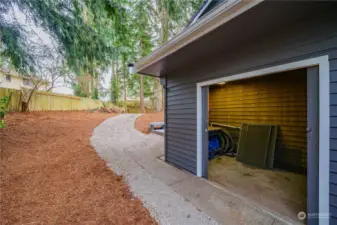 Tucked away on the side of the home, you'll find a spacious storage room—perfect for storing all your gardening tools and outdoor essentials.