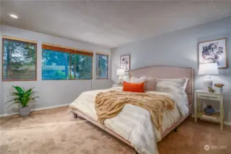 This tranquil room is generously sized to comfortably accommodate a king-sized bed.