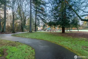 The park offers several paved trails that meander around the trees, ball fields, picnic areas, a large grassy field and a wetland area with wildlife.