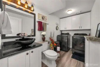 Large utility room on the main floor also with gorgeous flooring and brand new bath.