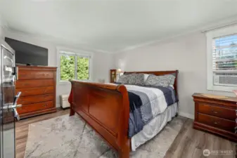 The primary suite is huge and as you can see, gorgeous flooring throughout the home. Wait until you see the sumptuous primary bath.