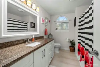 Another full main bath with new cabinets and granite vanity.