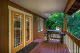 Here's a closer view of just one side of the private covered deck with the french doors leading to the kitchen and dining areas.