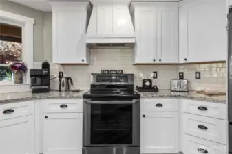 A closer view of the gorgeous kitchen features. Your window looks out over the shaded backyard.