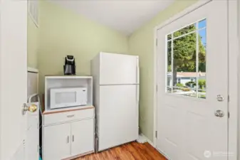 Laundry area right off the kitchen, the freezer, washer & dryer can stay.