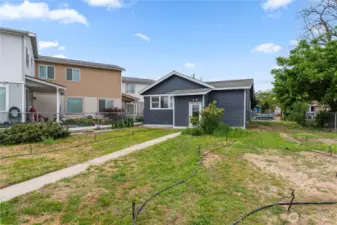 Side yard for gardening or play area.