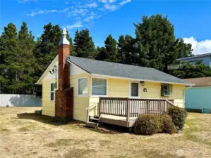 1215 199th Place Long Beach WA  Home is on a separate lot from the garage. Two lots are included in the sale. Lots of possibilities!