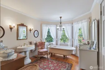 Primary bathroom with authentic claw foot tub and shower