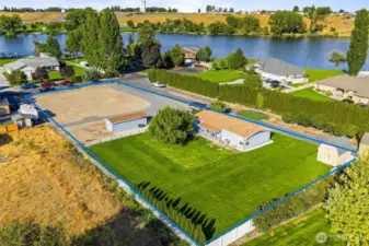 (property line is estimated). This serene location is easy to call home. Beautifully manicured backyard, parking for all your toys, and convenient access to the lake makes this property a true gem.